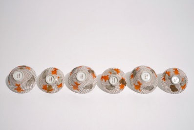 Six Japanese eggshell covered cups and saucers with carps, Meiji, 19th C.