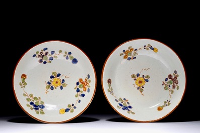 A pair of rare polychrome Dutch Delft bowls and covers, early 18th C.