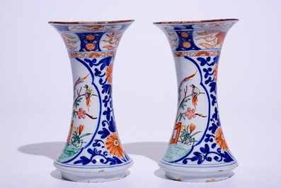 A pair of Dutch Delft polychrome petit feu Kakiemon-style vases, 18th C.