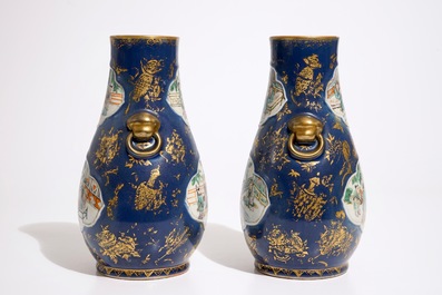 A pair of Chinese famille verte on powder blue and gilt ground vases, 19th C.