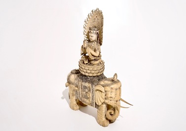 A large Chinese ivory group of Buddha seated on an elephant, late 19th C.