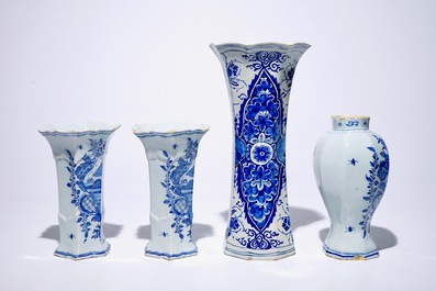 A Dutch Delft blue and white three-piece garniture and a large singular vase, 18th C.