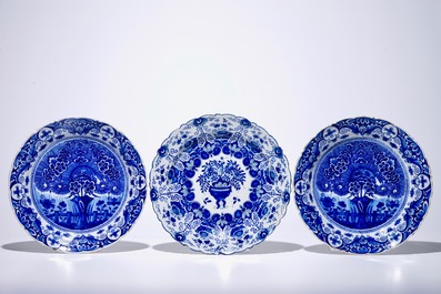 A pair of Dutch Delft blue and white &quot;Tea Tree&quot; dishes and a dish with a flower basket, 18th C.