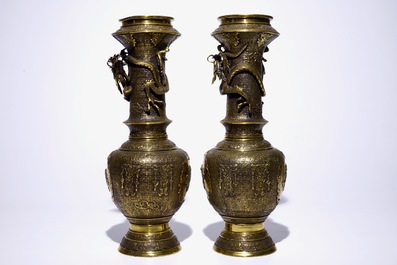 A pair of Japanese gilt brass vases with applied dragons, Meiji/Taisho, 19/20th C.