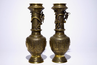 A pair of Japanese gilt brass vases with applied dragons, Meiji/Taisho, 19/20th C.