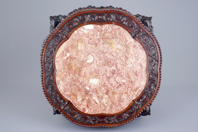 A large round Chinese carved wood stand with marble inset, 19th C.