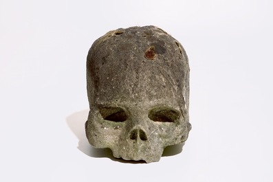 A carved limestone model of a skull or Memento Mori, 16th C.
