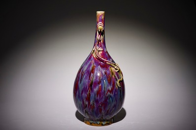 A Chinese monochrome flambe-glazed bottle vase with dragon handles, 19th C.