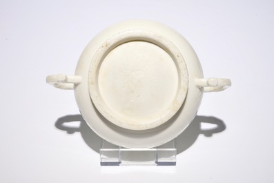 A round Chinese Dehua blanc de Chine censer with moulded and underglaze decoration, 19th C.