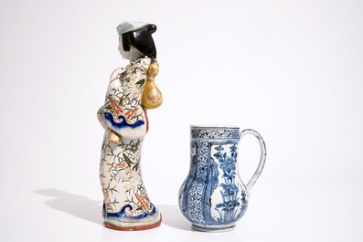 A blue and white Arita jug and a plate, 17/18th C., with an Imari figure, 18/19th C.