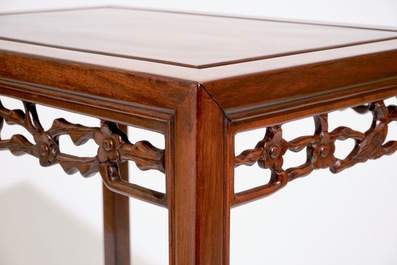 A set of four Chinese sculpted hardwood stacking tables, 20th C.