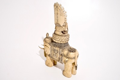 A large Chinese ivory group of Buddha seated on an elephant, late 19th C.