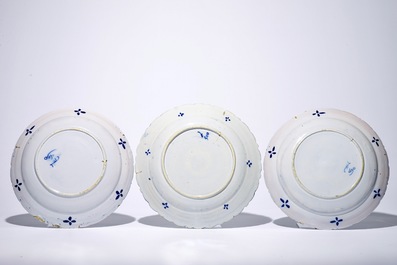 A pair of Dutch Delft blue and white &quot;Tea Tree&quot; dishes and a dish with a flower basket, 18th C.