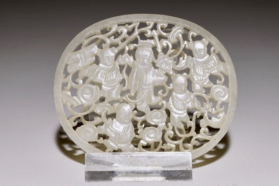 A Chinese reticulated jade plaque, on wooden stand, 19th C.