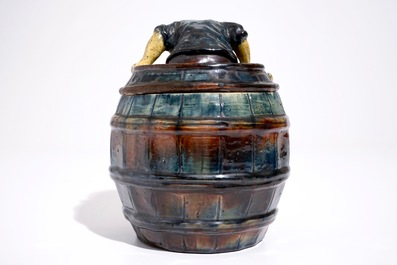 A Flemish pottery tobacco jar with a man in a barrel, prob. Vandevoorde workshop, 20th C.