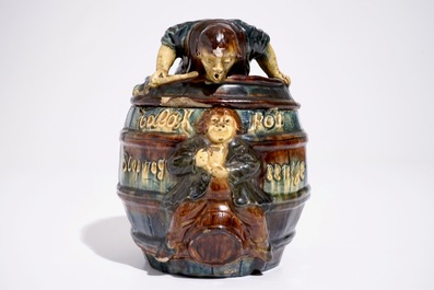 A Flemish pottery tobacco jar with a man in a barrel, prob. Vandevoorde workshop, 20th C.