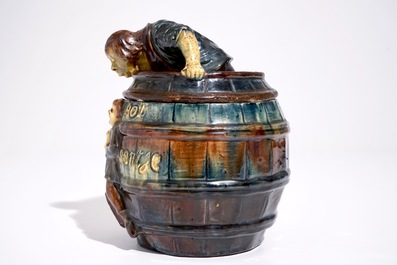 A Flemish pottery tobacco jar with a man in a barrel, prob. Vandevoorde workshop, 20th C.