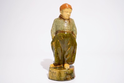 A Flemish pottery figure, &quot;The little farmer&quot;, prob. Laigneil workshop, 20th C.