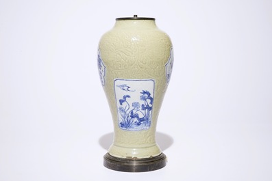 Un vase en porcelaine de Chine &agrave; d&eacute;cor en bleu et blanc sur fond c&eacute;ladon incis&eacute;, mont&eacute; en lampe, Kangxi