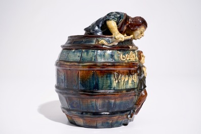 A Flemish pottery tobacco jar with a man in a barrel, prob. Vandevoorde workshop, 20th C.