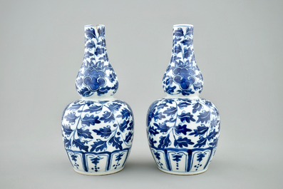 A pair of Chinese blue and white lotus scroll double gourd vases, Xuande mark, 19th C.