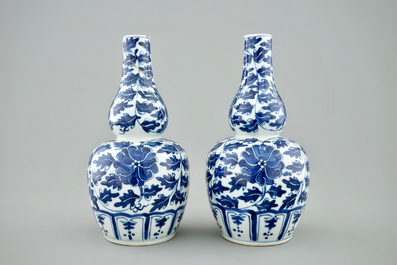 A pair of Chinese blue and white lotus scroll double gourd vases, Xuande mark, 19th C.