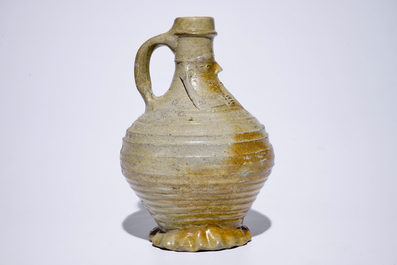 An stoneware pointed nose jug with a bagpipe player, Aachen or Raeren, 15/16th C.