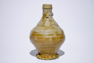 An stoneware pointed nose jug with a bagpipe player, Aachen or Raeren, 15/16th C.