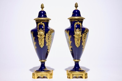 A pair of French ormolu-mounted covered vases in S&egrave;vres style, France, 20th C.