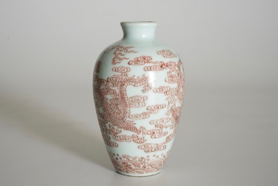 A Chinese vase with underglaze red with dragons among clouds, 19/20th C.