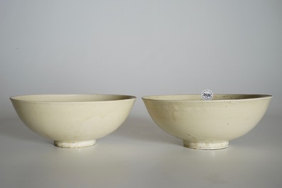 A pair of Chinese monochrome cream-glazed bowls, Northern Song or Jin