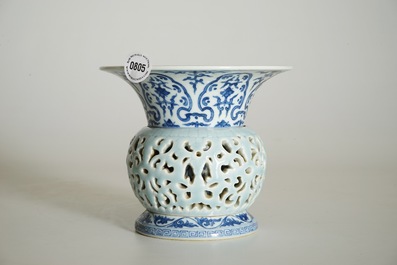 A rare blue, white and lavender-glazed reticulated revolving zhadou spittoon, Qianlong mark, 19/20th C.