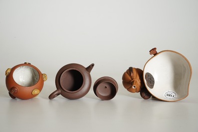 A Chinese Yixing peach-shaped bowl, a round bowl and a teapot with cover, 19/20th C.