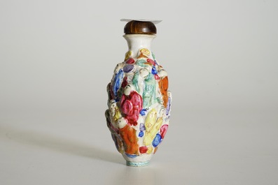A Chinese famille rose moulded snuff bottle with 18 Luohan, Xianfeng mark and poss. period