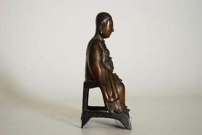 A Chinese bronze model of a seated Zhenwu, Ming