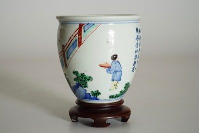 A Chinese wucai brush pot on wooden stand, Transitional period