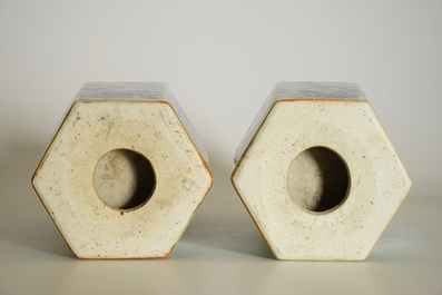 A pair of Chinese hexagonal blue and white on celadon ground vases with buddhist lions, 19th C.