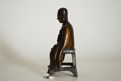 A Chinese bronze model of a seated Zhenwu, Ming