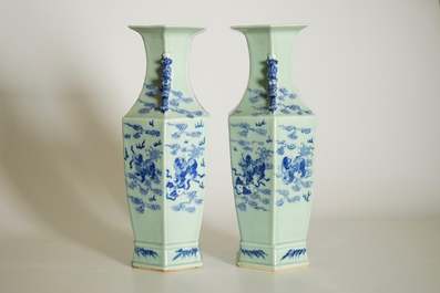 A pair of Chinese hexagonal blue and white on celadon ground vases with buddhist lions, 19th C.