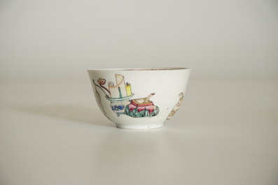 A Chinese famille rose cup and saucer with a lady and a boy, Yongzheng