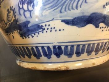 A large Dutch Delft blue and white jug with a tiger and a lion, 17th C.