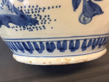 A large Dutch Delft blue and white jug with a tiger and a lion, 17th C.