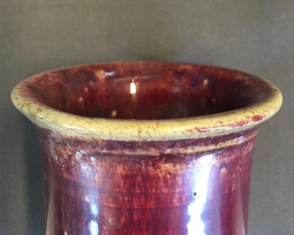 A Chinese monochrome sang-de-boeuf-glazed brush pot, a beaker vase and a bowl, 19/20th C.