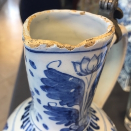 A large Dutch Delft blue and white jug with a tiger and a lion, 17th C.