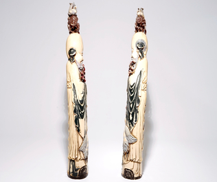 A pair of tall Chinese polychrome carved ivory figures of immortals, 19/20th C.