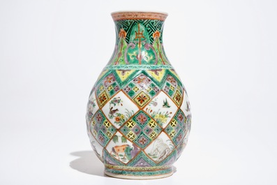 A Chinese famille verte vase with exotic animals, 19th C.