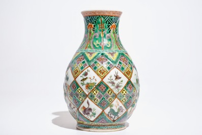 A Chinese famille verte vase with exotic animals, 19th C.