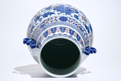 A Chinese copper-red and underglaze blue peony scroll hu vase, Qianlong mark, 19th C.