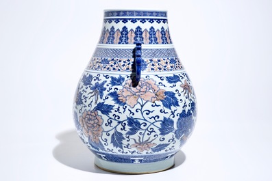 A Chinese copper-red and underglaze blue peony scroll hu vase, Qianlong mark, 19th C.