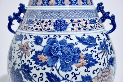 A Chinese copper-red and underglaze blue peony scroll hu vase, Qianlong mark, 19th C.